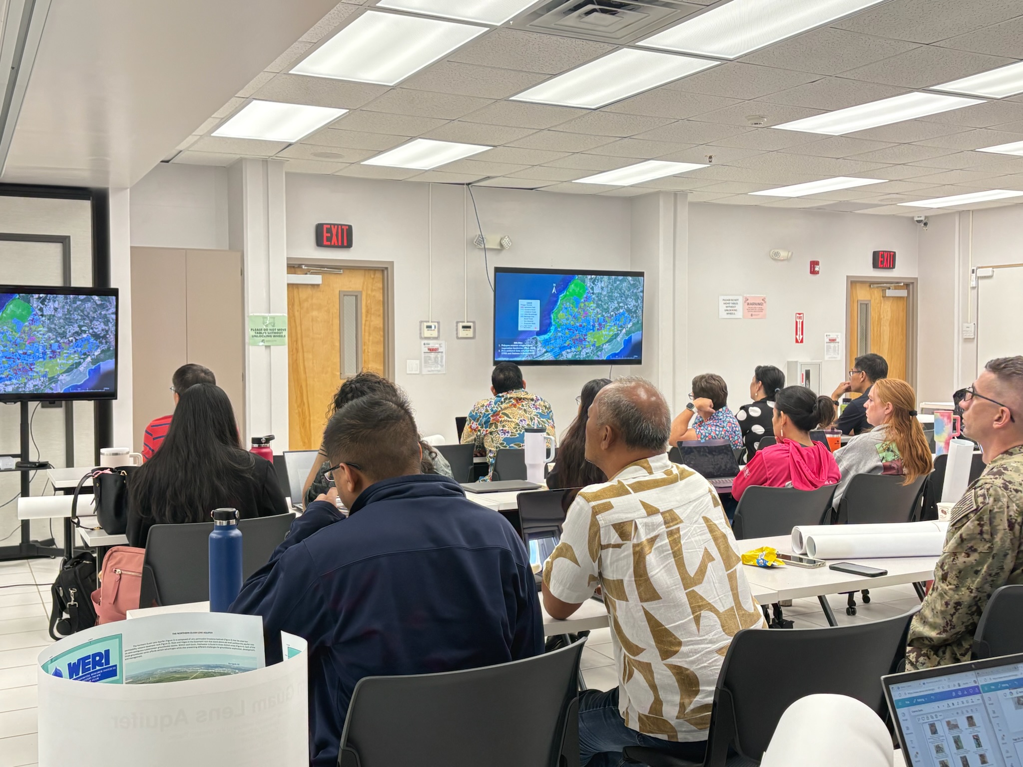 The crowd observes the NGLA map during Dr. Habana's presentation. Photo by WERI.