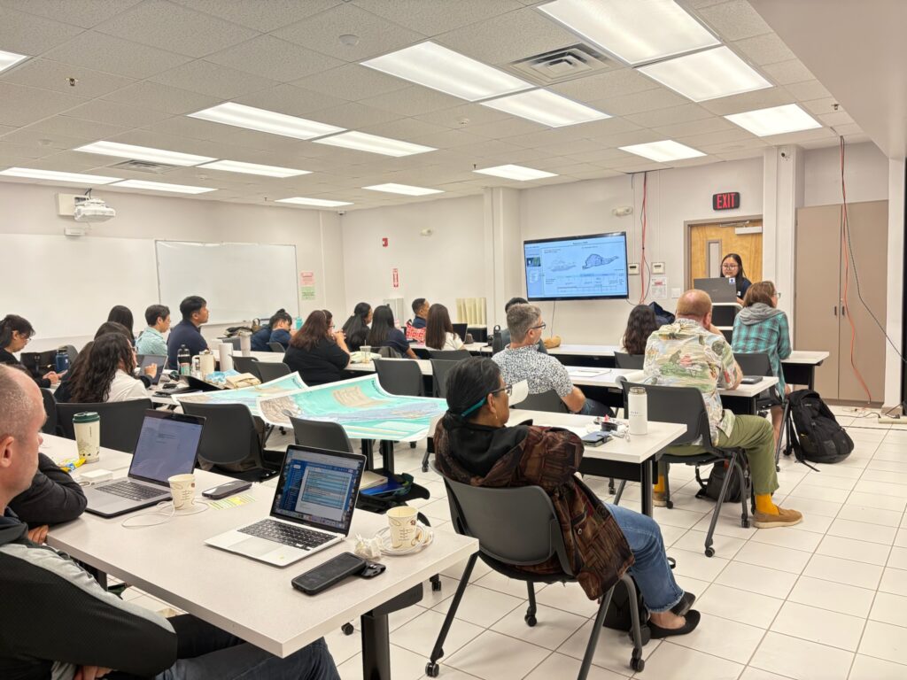Crowd listening intently to Ms. Bautista's  research findings.