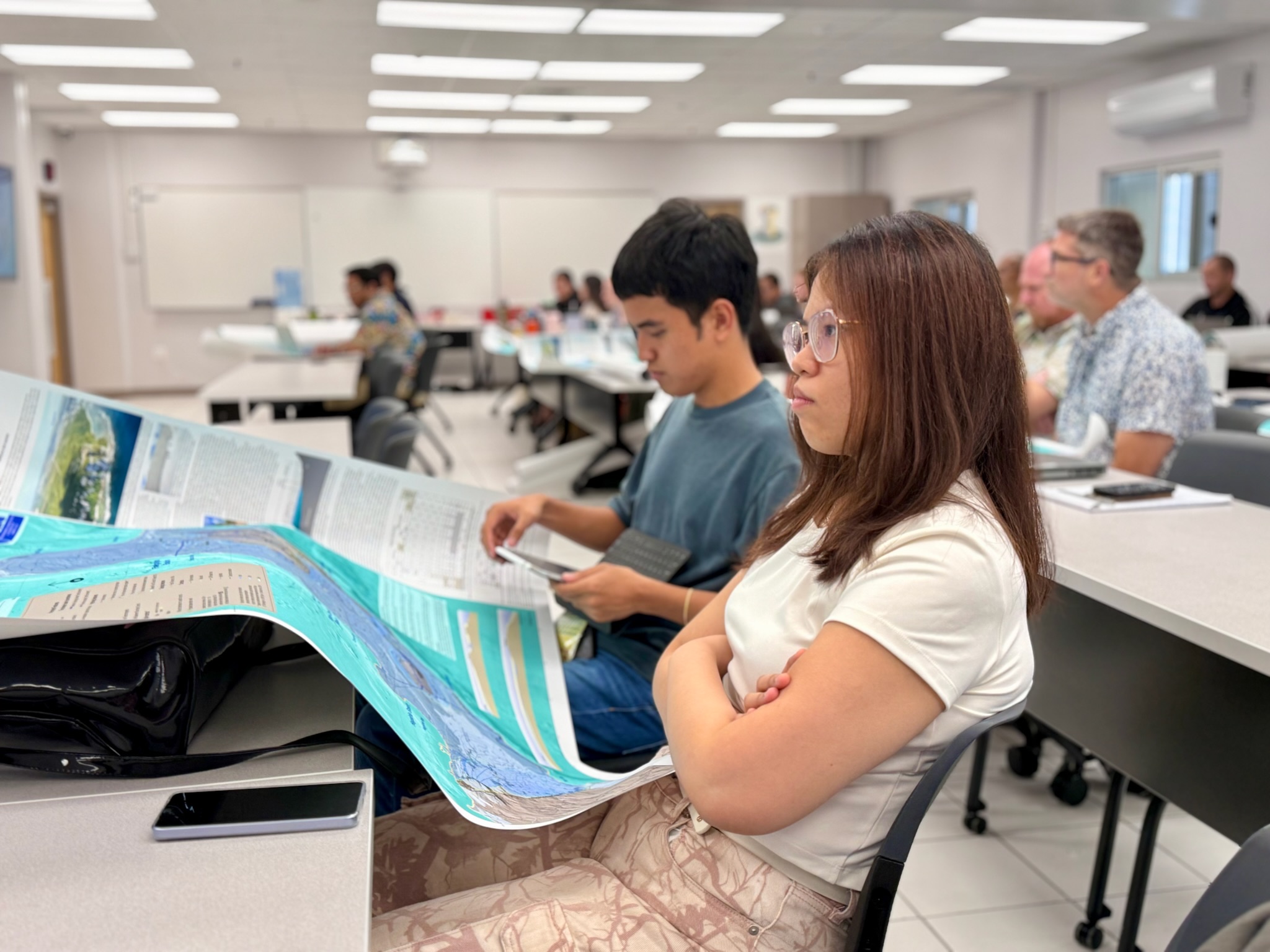 WERI RA's James Trono, and Ronalyn Ocampo, participate in Dr. Habana's NGLA map activity. Photo by WERI.