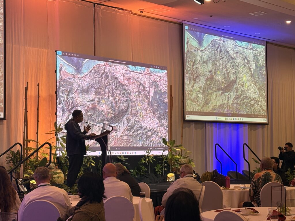 Dr. Habana, WERI hydrologist showcasing the detail in his newest cutting-edge map.